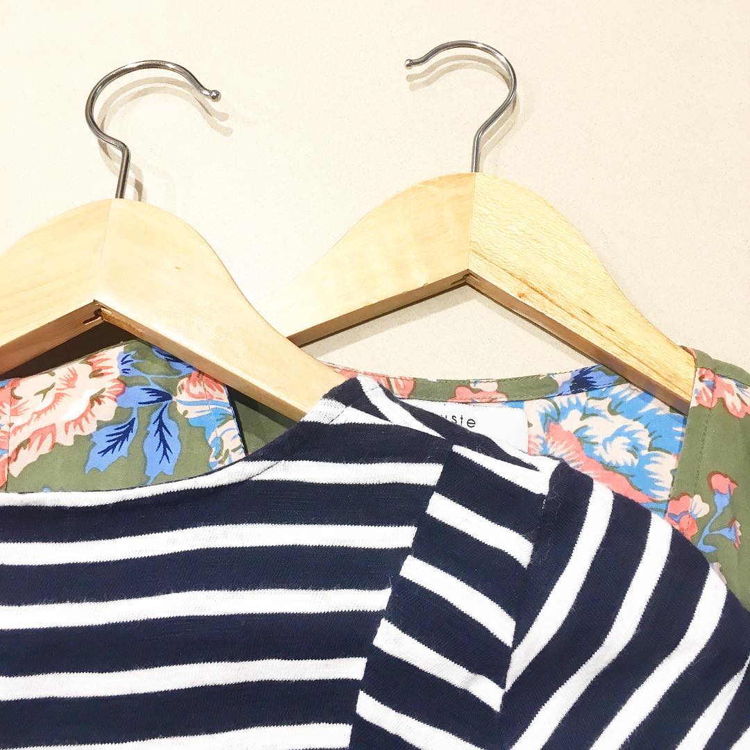 Striped and floral shirt on hangers. Photo by Instagram user @the_smallist