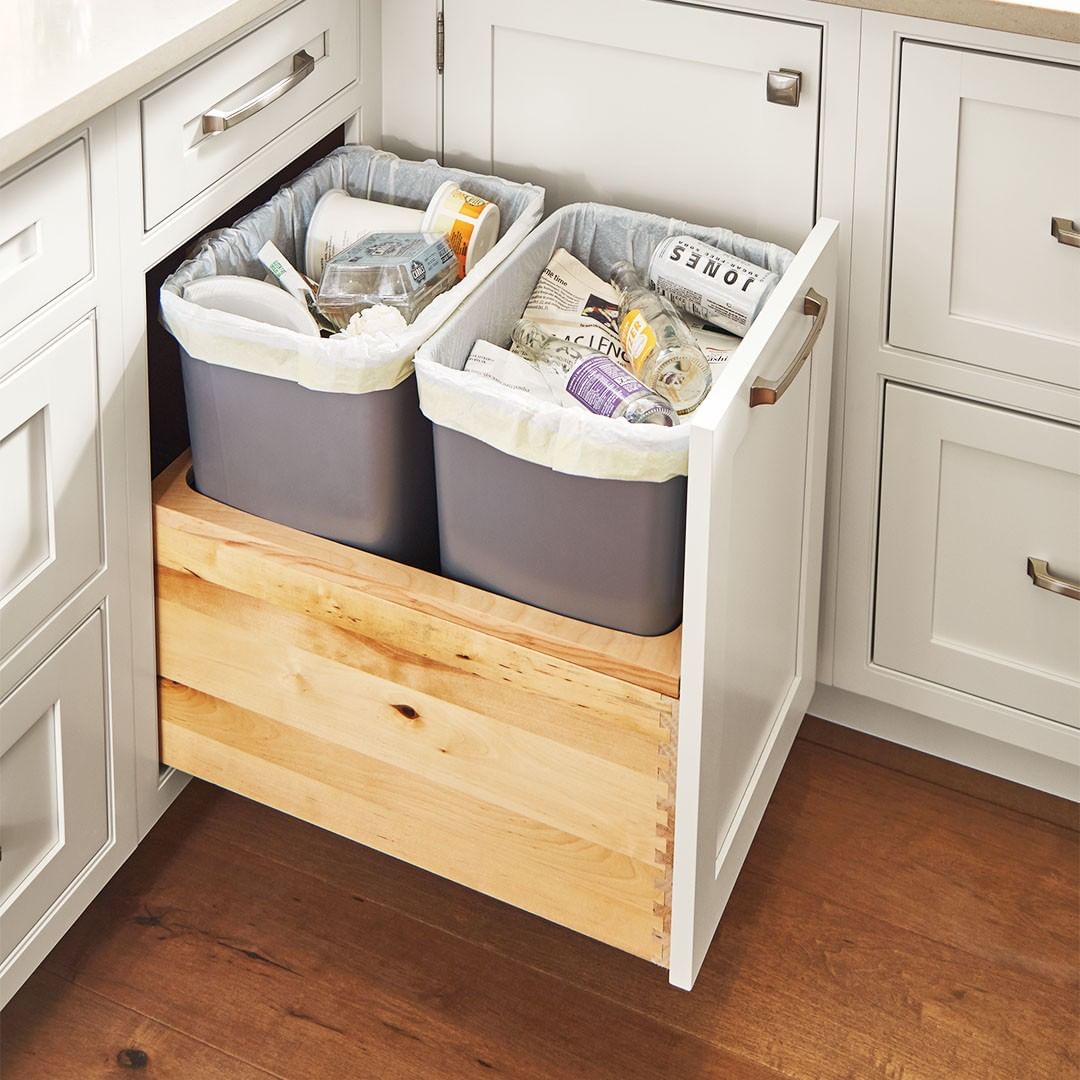 Hidden trash kitchen cabinet. Photo by Instagram user @masterbrandcabinets