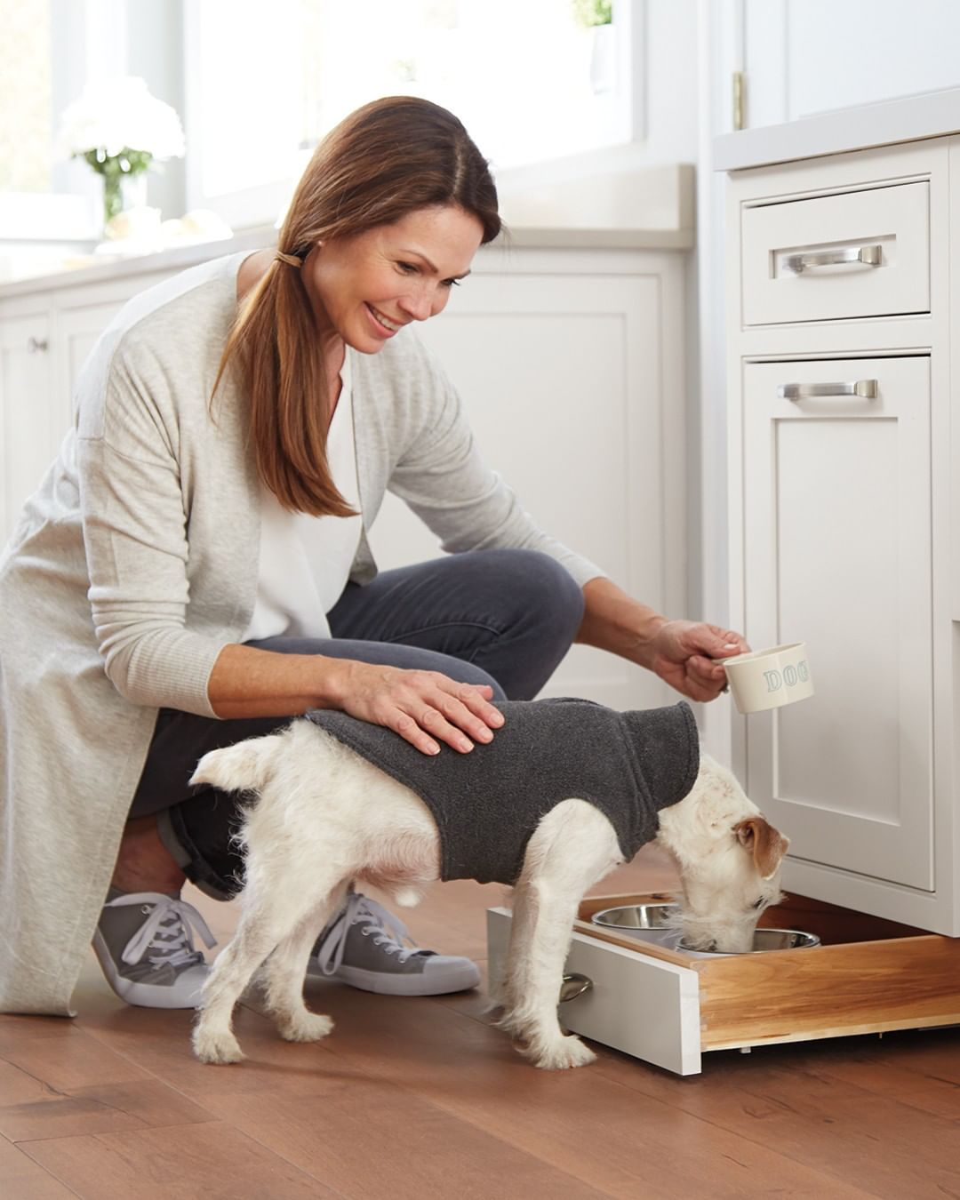 Hidden pet food drawer in kitchen. Photo by Instagram user @masterbrandcabinets