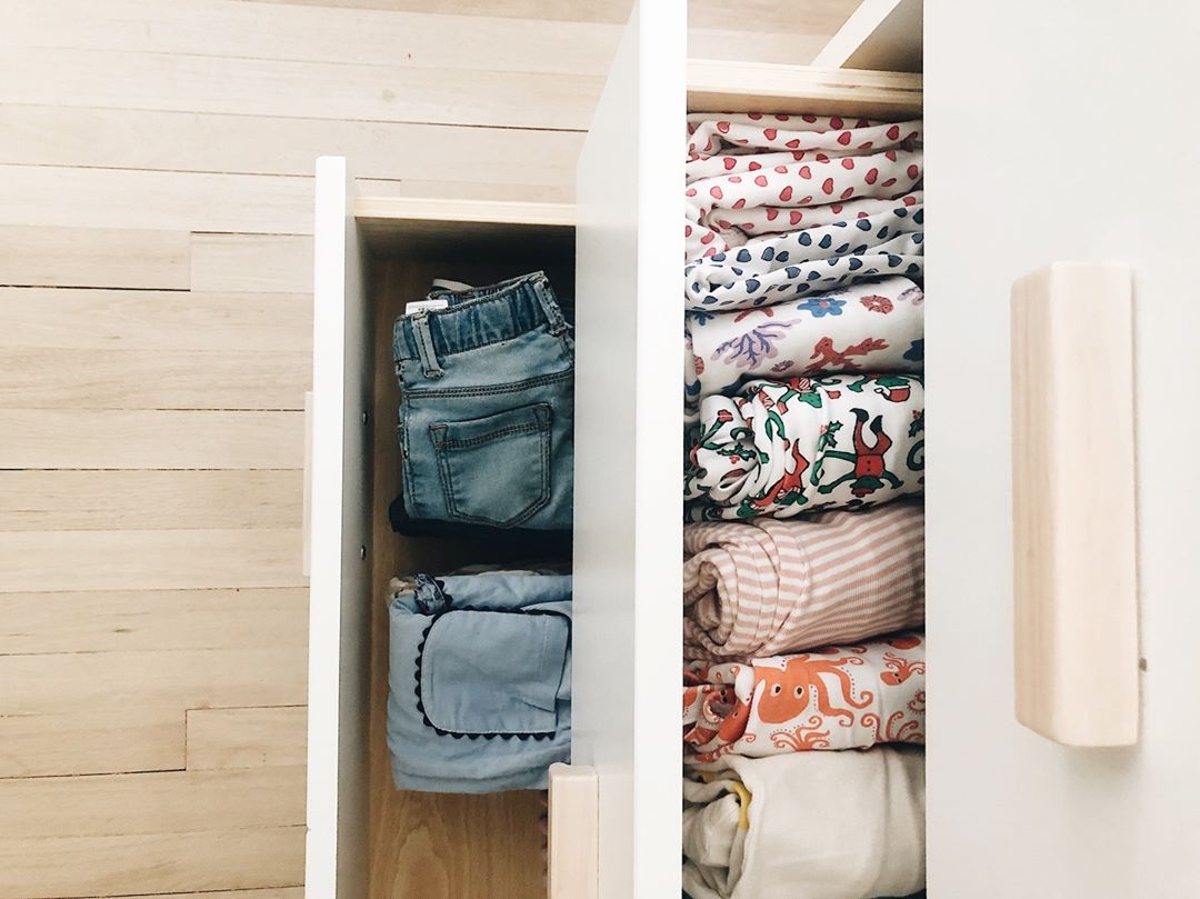 Kids pants and shirts inside drawers. Photo by Instagram user @dwellxfoster