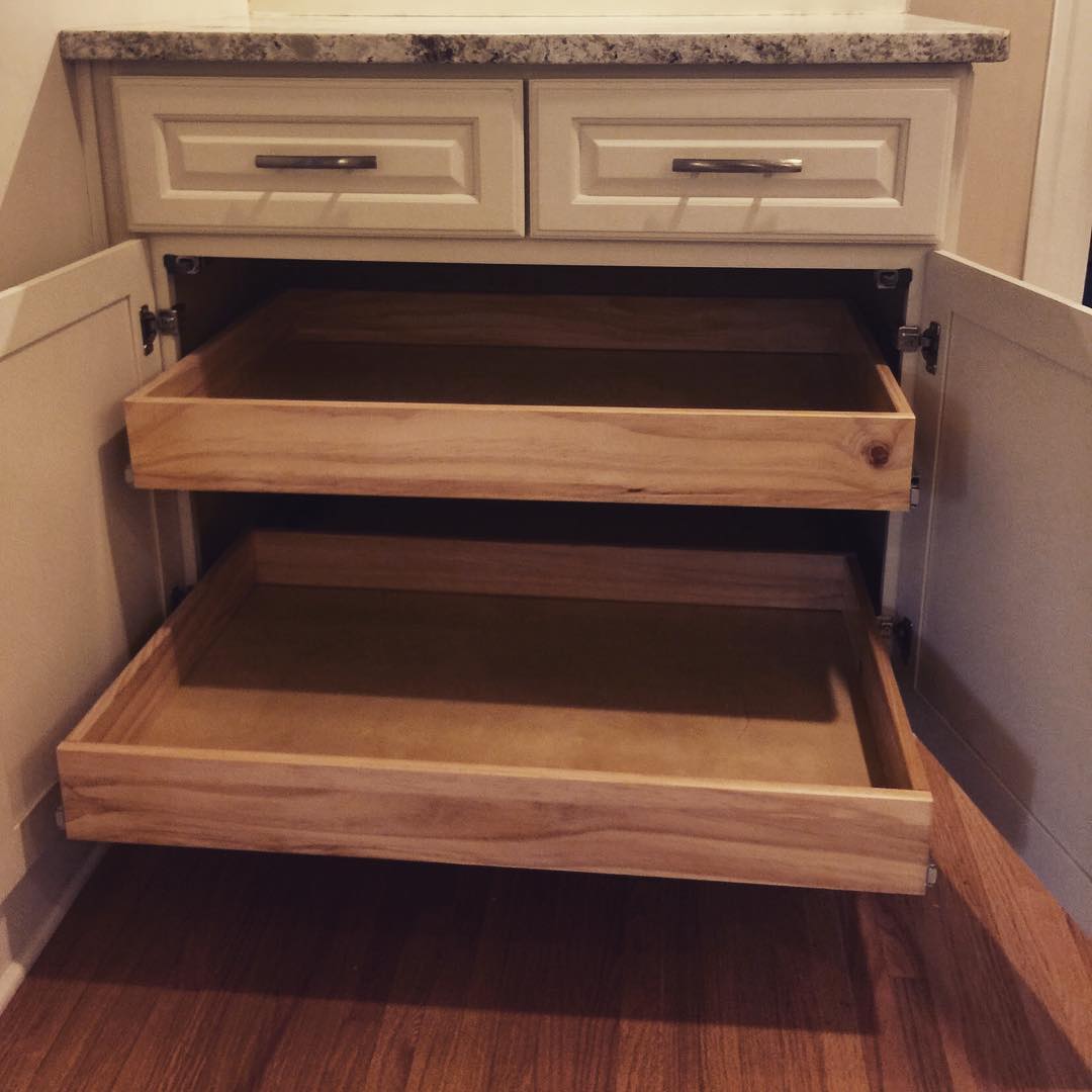 Base kitchen cabinet with tiered pullout drawers. Photo by Instagram user @thehomeprosgroup