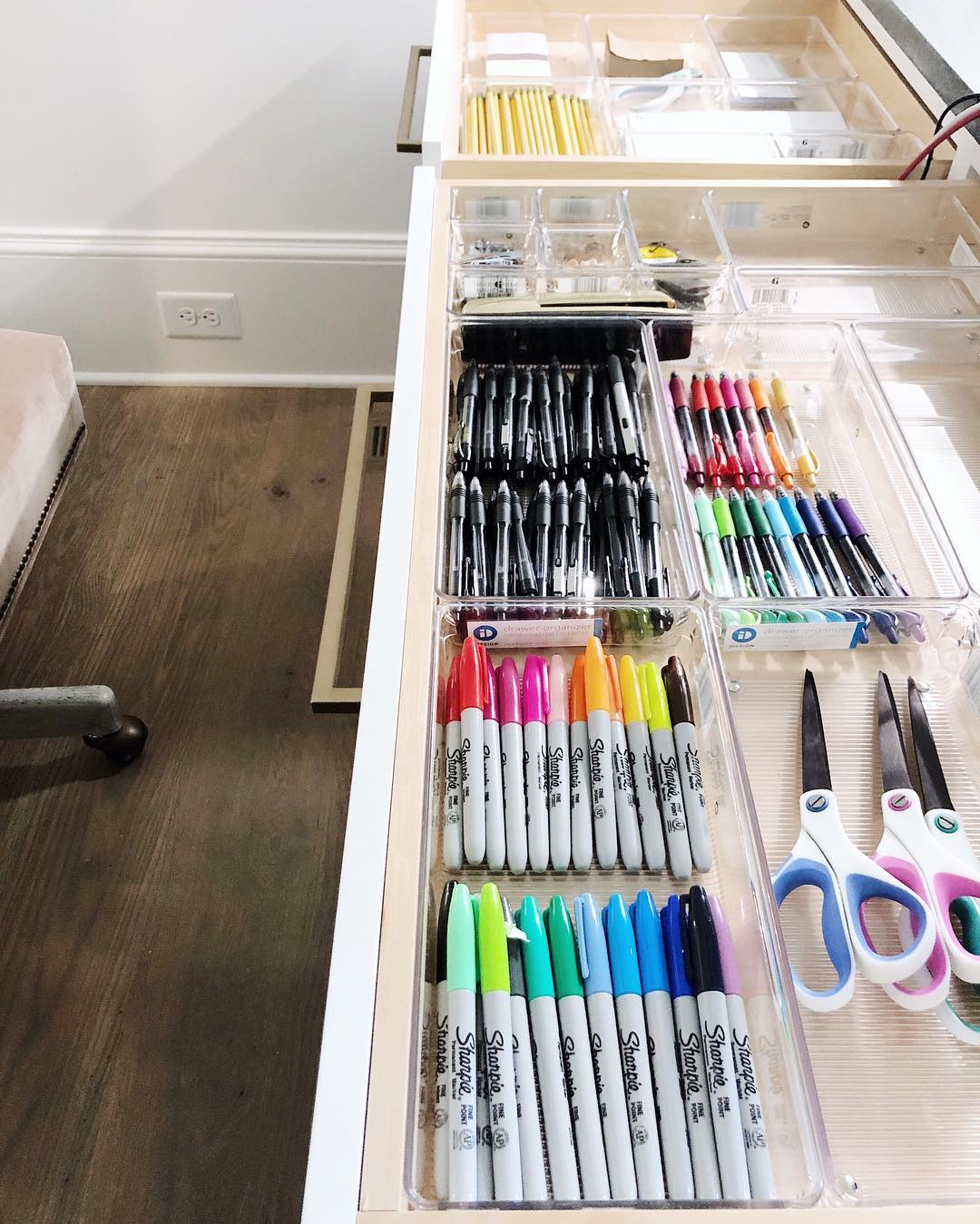 Pens and markers organized in a drawer. Photo by Instagram user @getminimized