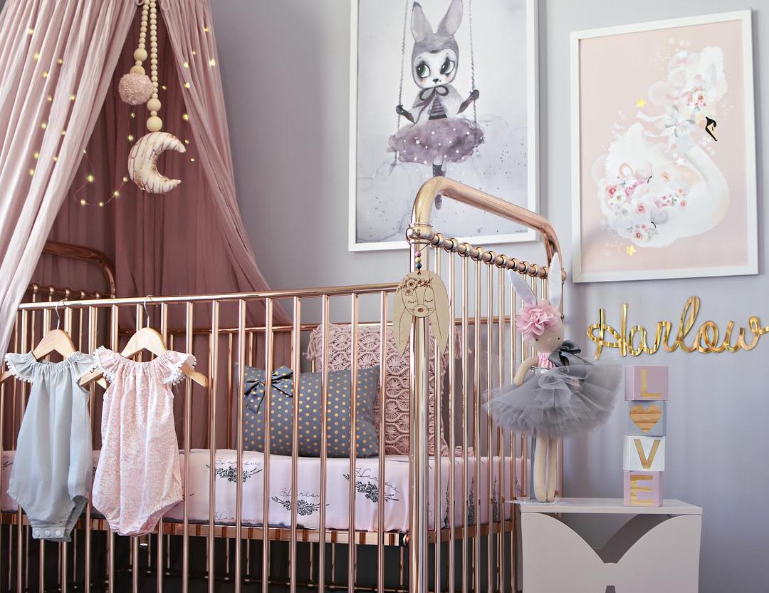 Baby girl nursery with unique wall decor. Photo by Instagram user @hudson_and_harlow