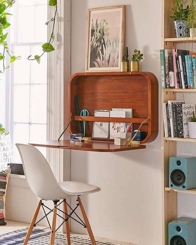 Fold-down hideaway desk in apartment. Photo by Instagram user @socalselfstorage