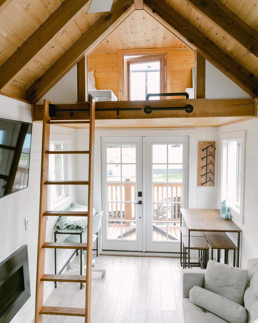 Small Living Space with Loft Space Above Front Door. Photo by Instagram user @jethospitality
