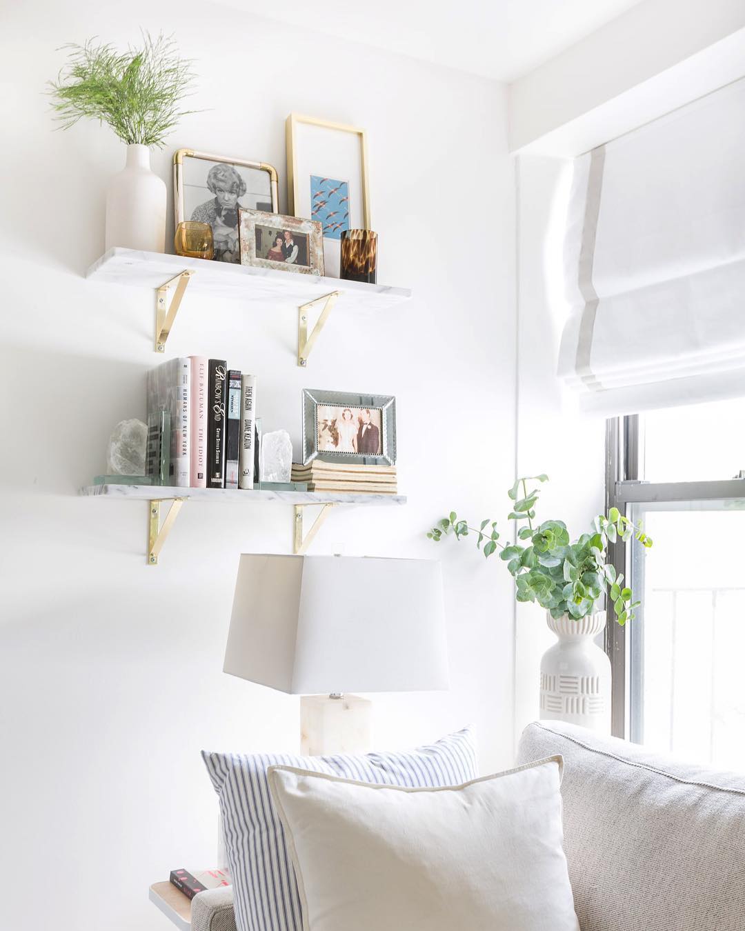 Vertical wall storage in small apartment. Photo by Instagram user @kelseyannrose