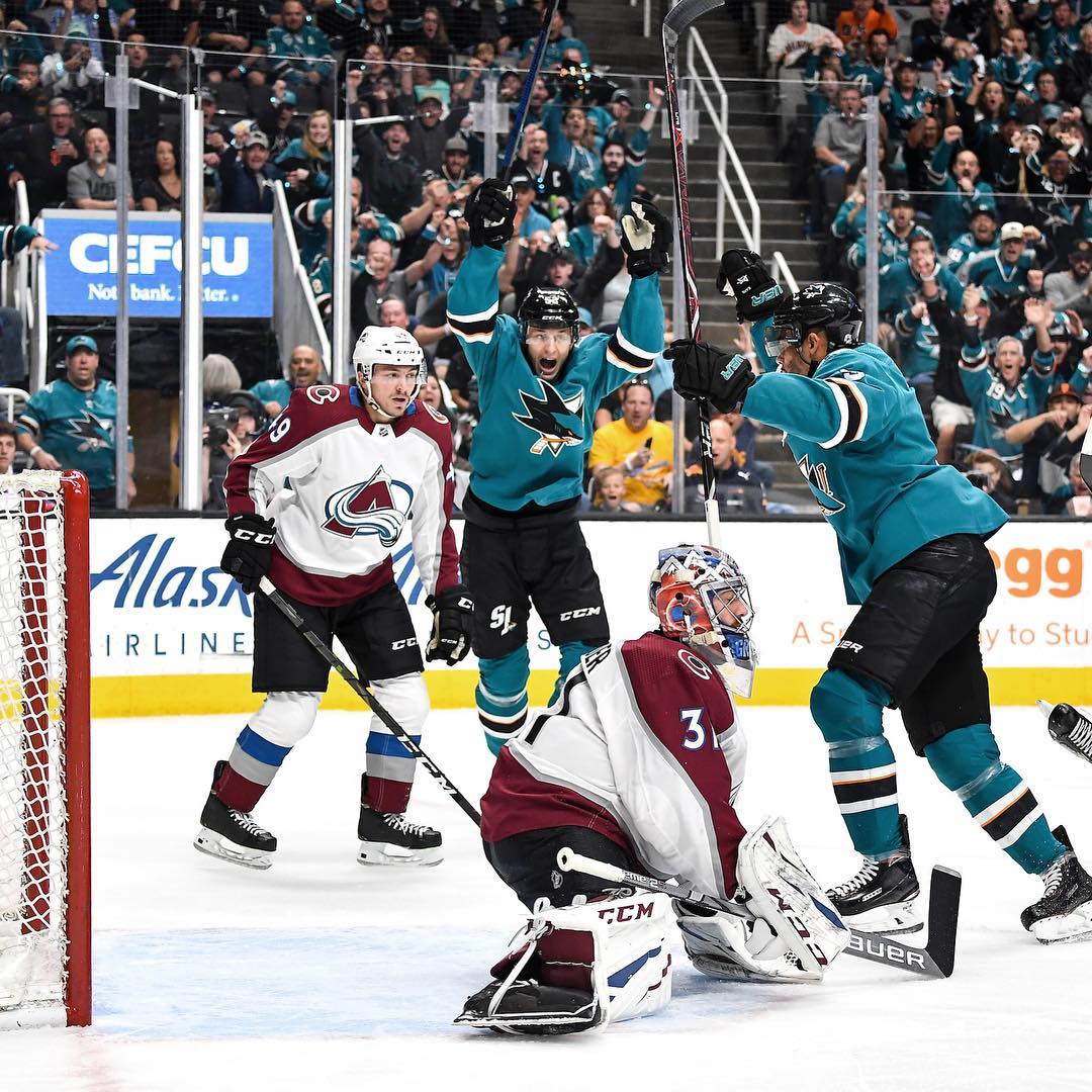 San Jose Sharks hocket players celebrate after a goal while two opposing players look on with disappointment. Photo by Instagram user @sanjosesharks