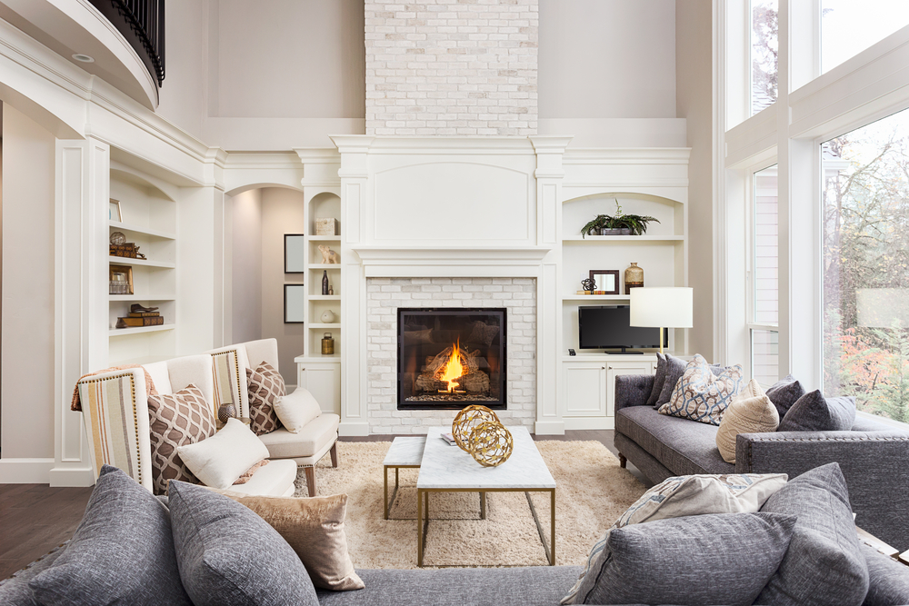 Luxury living room with fireplace and large windows