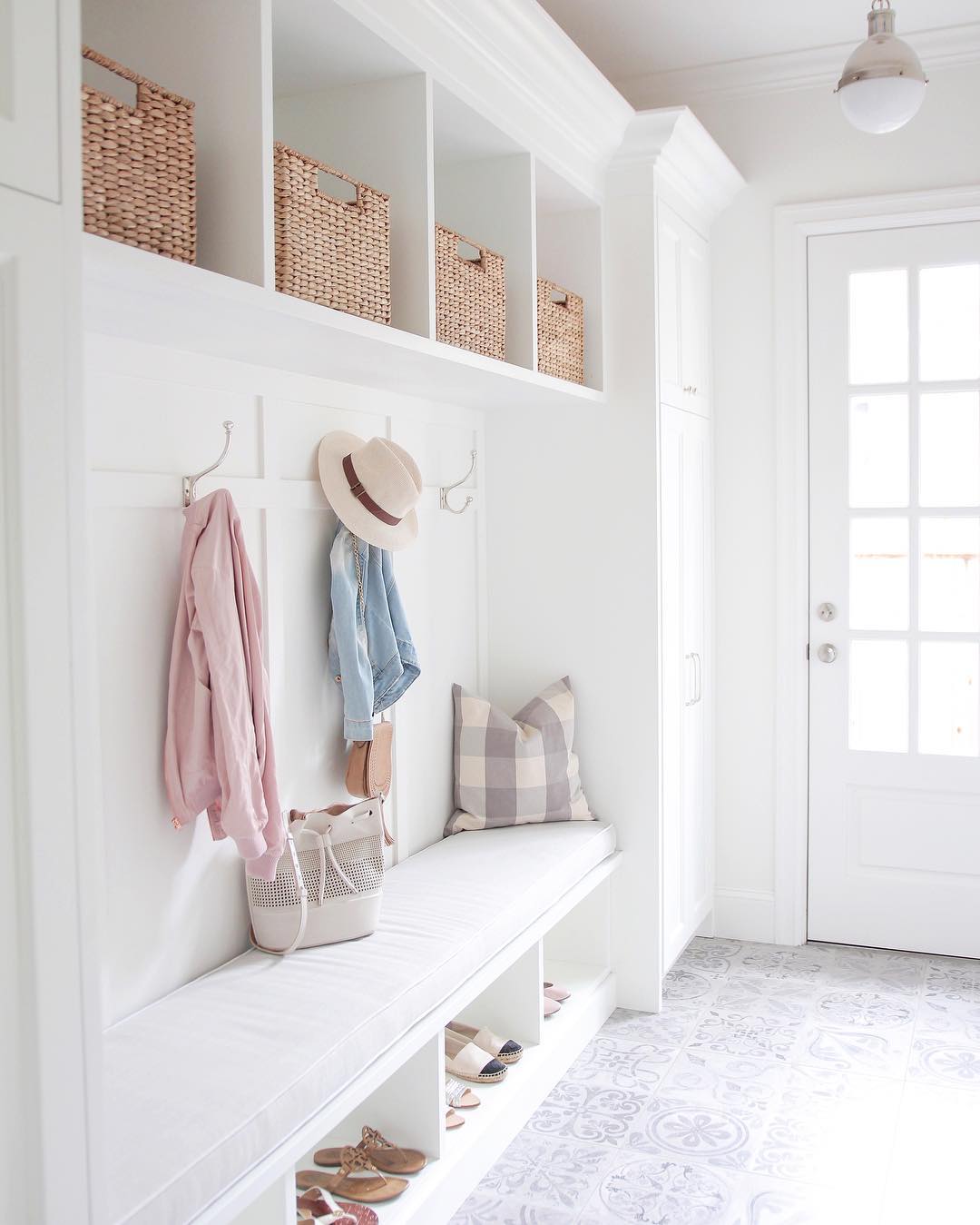 Clean, white mudroom. Photo by Instagram user @jseveryday