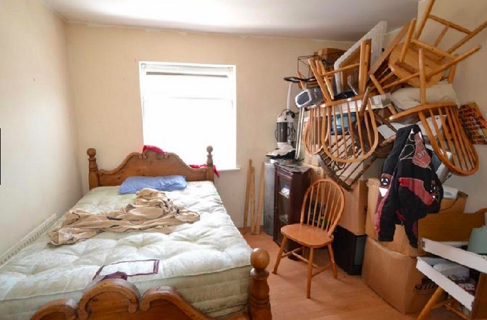 Guest room cluttered with chairs