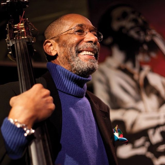 Sir Ron Carter holding the neck of a bass. Photo by Instagram user @wlylebass