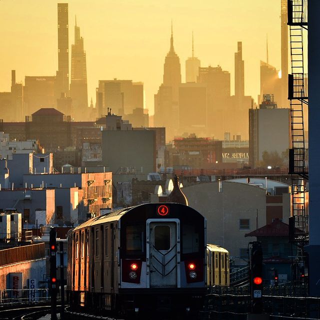 View of a New York City train and the skyline. Photo by Instagram user @thecityandthesubway