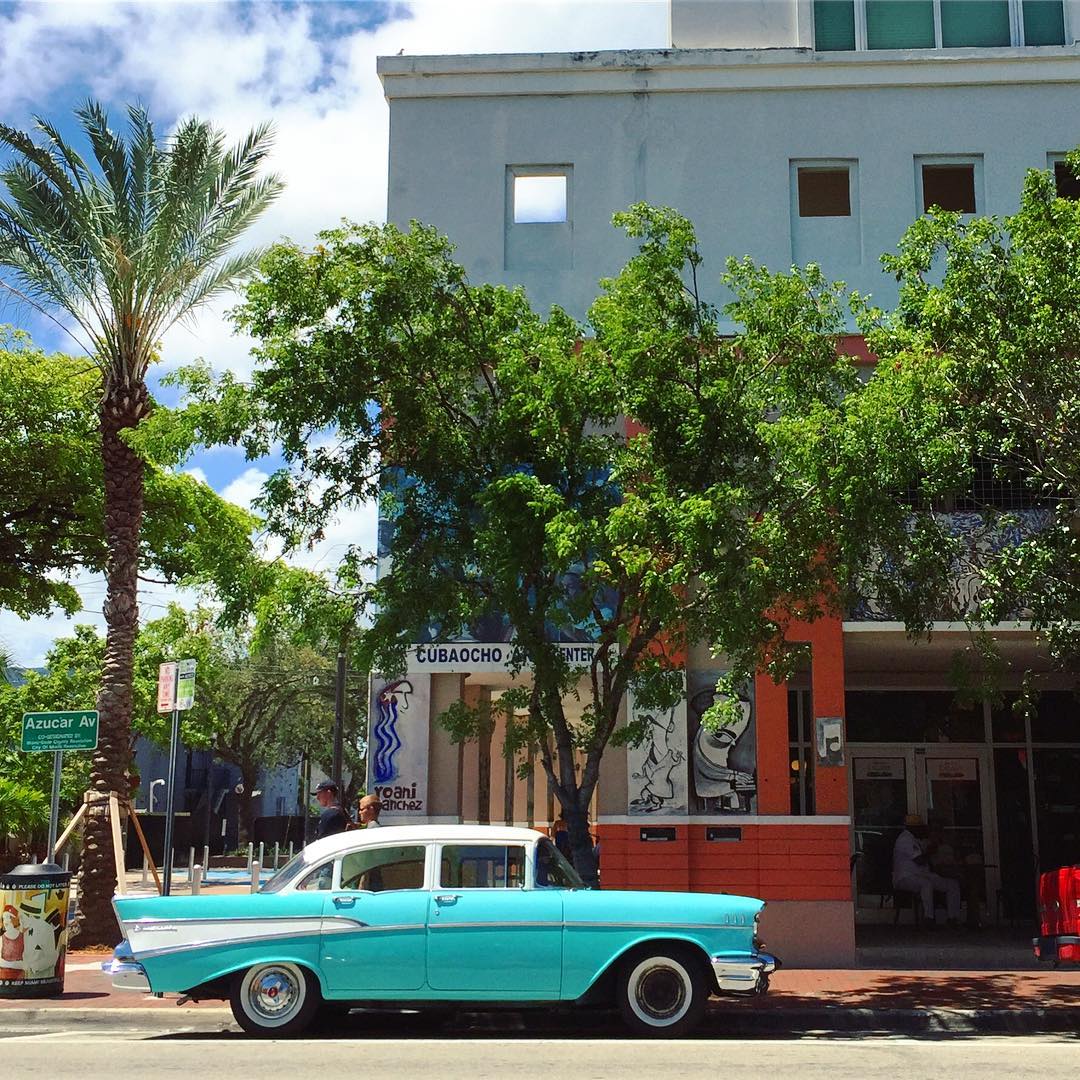 Blue classic car parked on a street in Little Havana Photo by Instagram user @kwoodellis