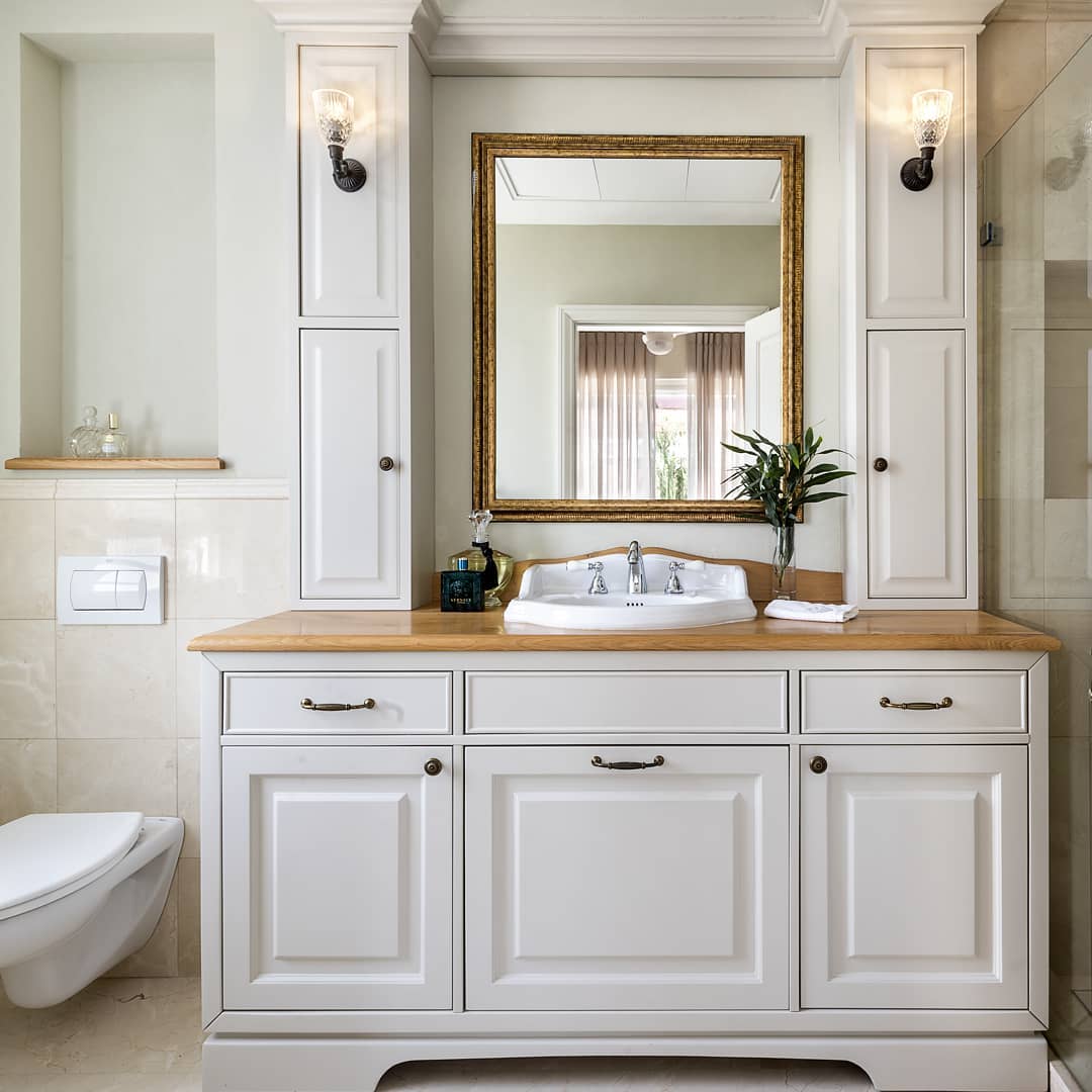 Clean, white bathroom with spacious sink. Photo by Instagram user @sharon_arny_interior_design
