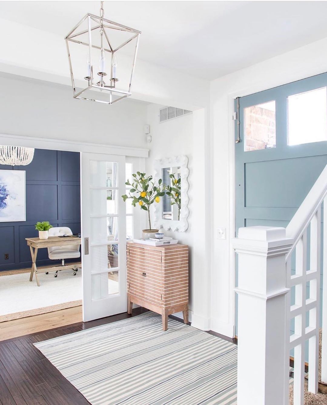 Entryway with white and light blue design. Photo by Instagram user @kathykuohome