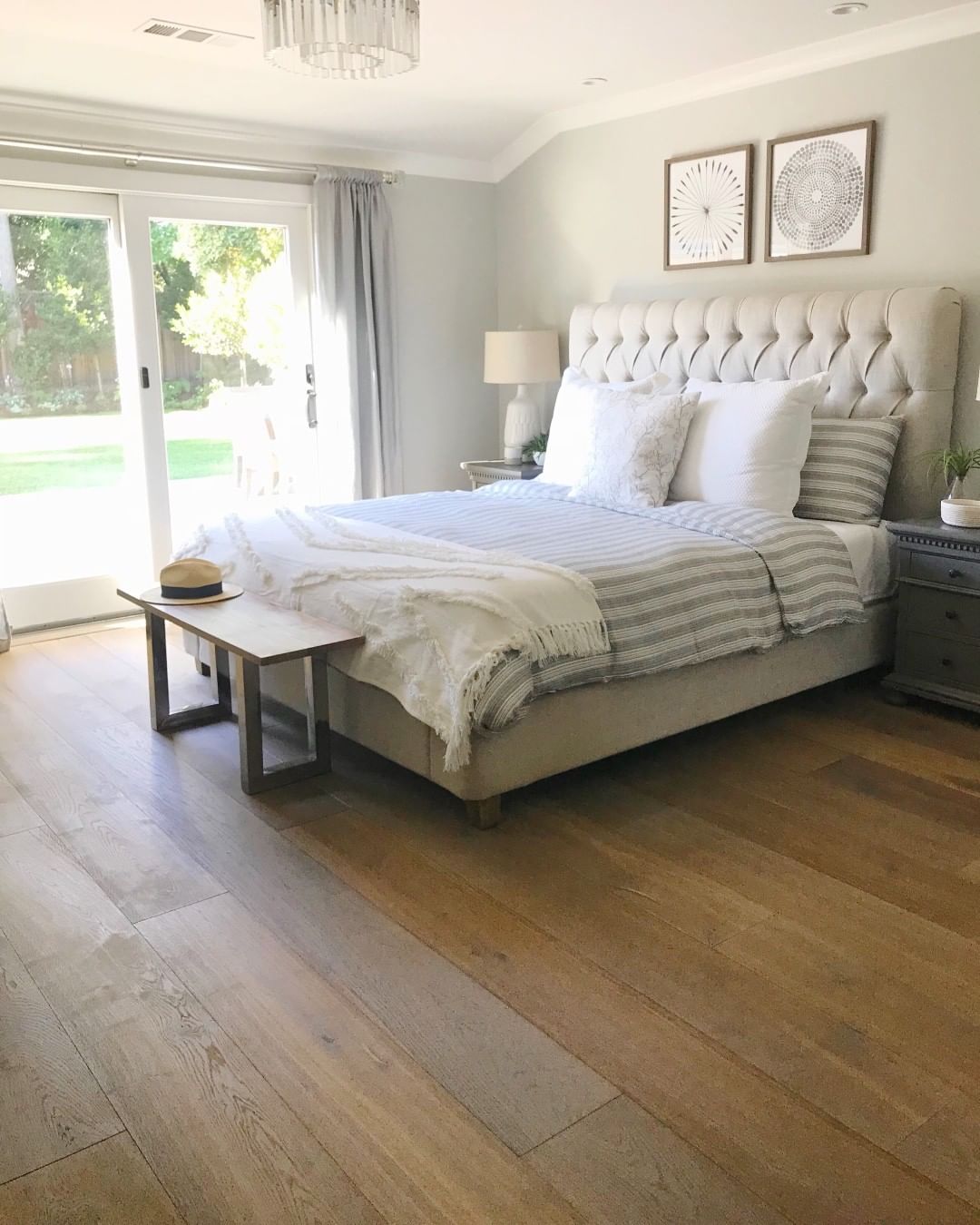 Bedroom with wood plank floors. Photo by Instagram user @monarchplank