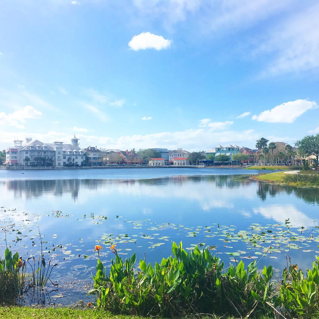 Looking across an open lake at hotels and others businesses lakeside. Photo by Instagram user @aroundmyflorida