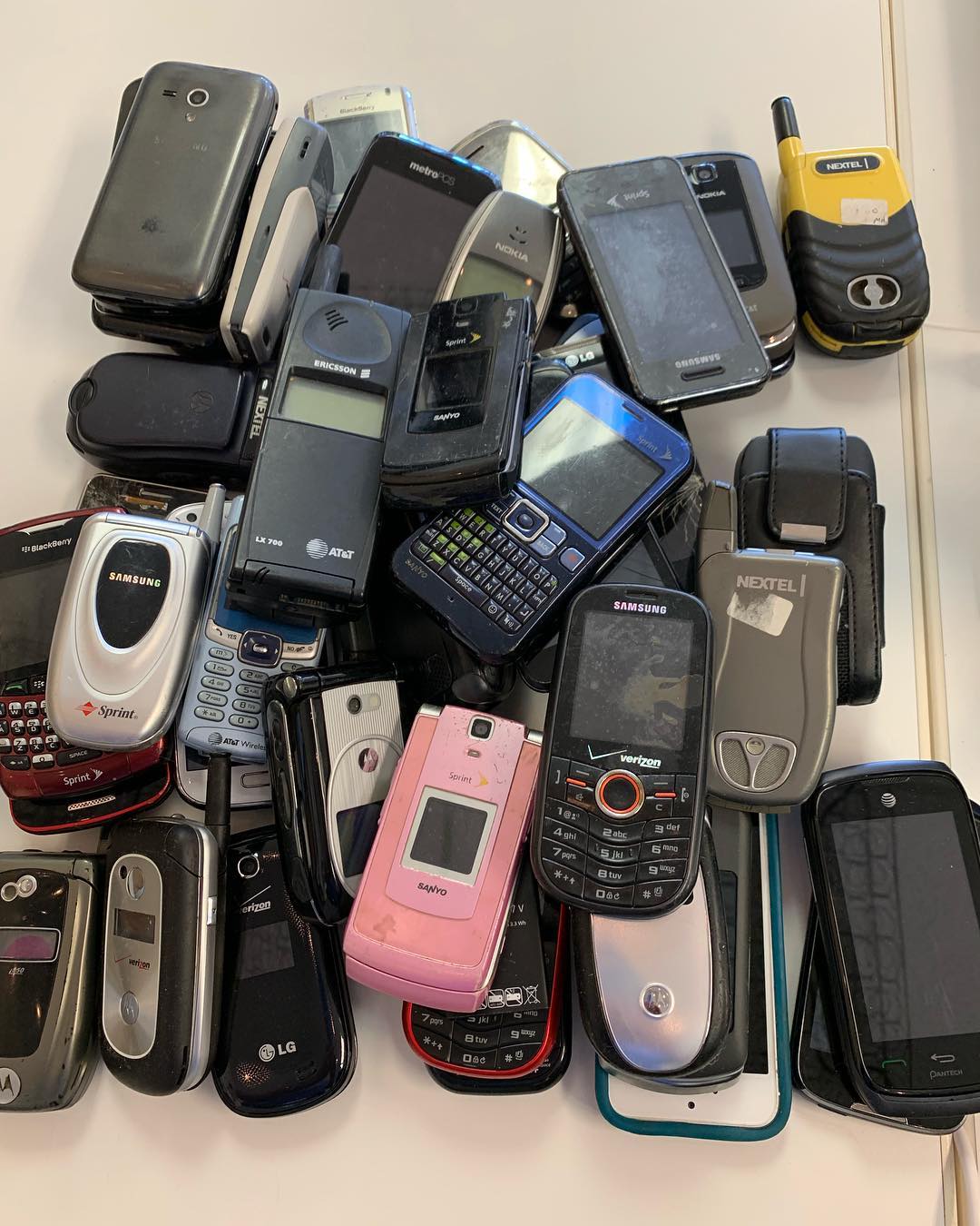 Pile of cellphones for donation. Photo by Instagram user @beducationmattress