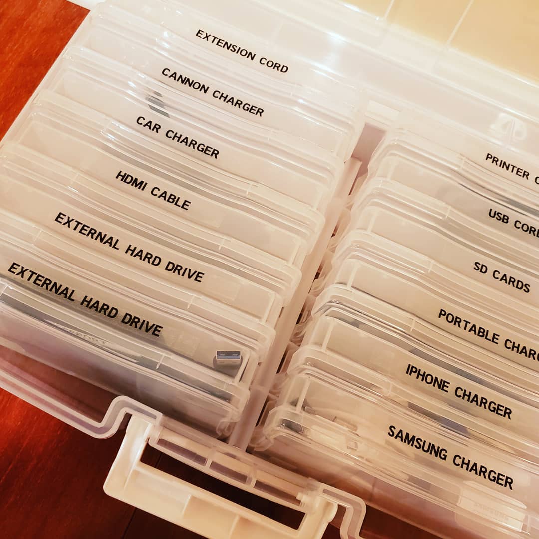 Organized cords with labels in clear container. Photo by Instagram user @beforeandafter_org