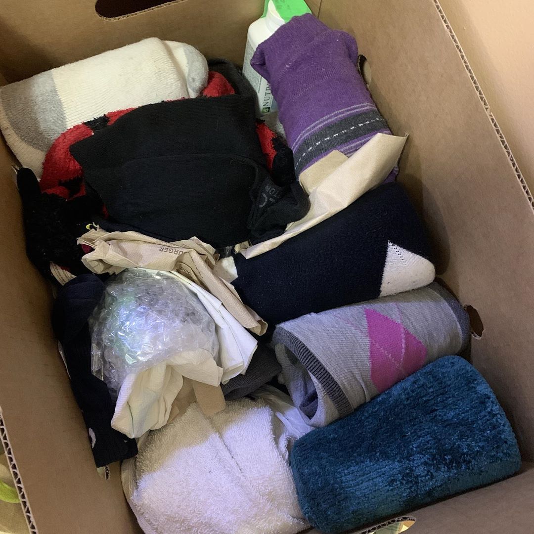 Moving boxes with items wrapped in clothes. Photo by Instagram user @miss.brandice