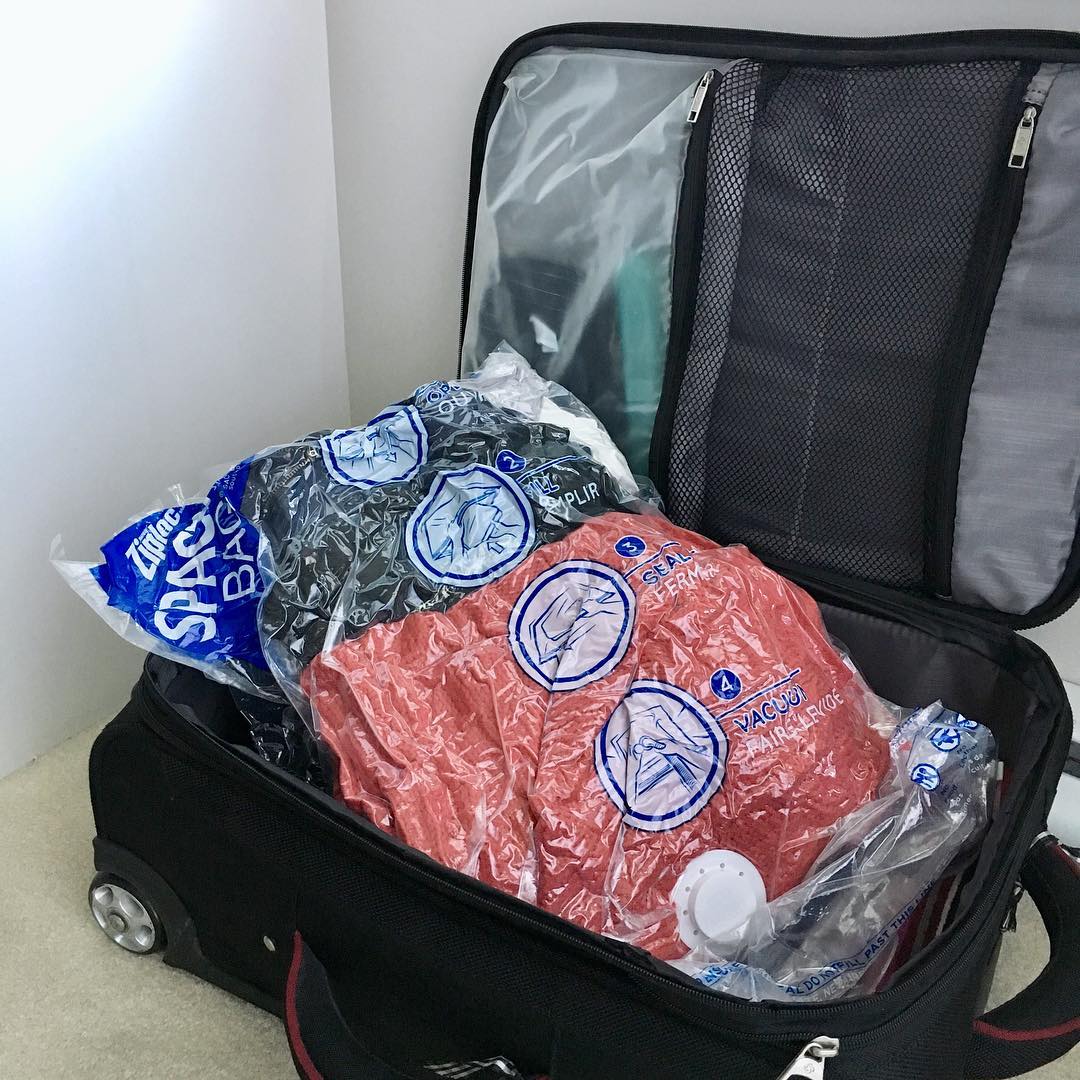 Vacuum-sealed bags in luggage. Photo by Instagram user @lemonadebungalow