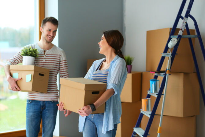 Man and woman packing boxes