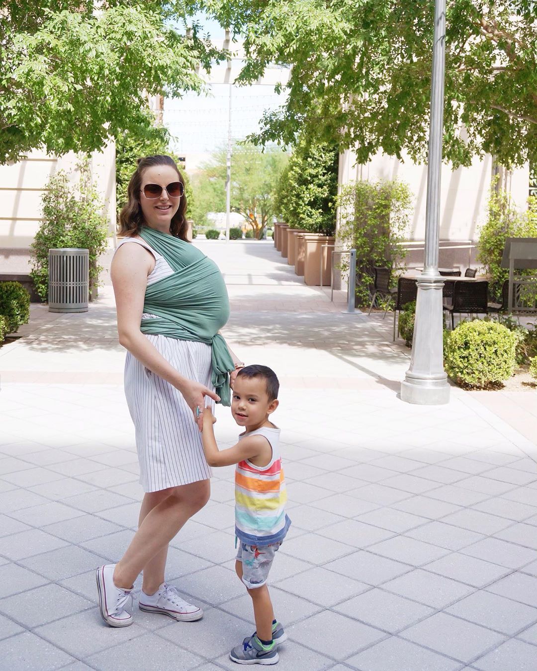Mom carrying baby and walking with son. Photo by Instagram user @kathleen.ordinario