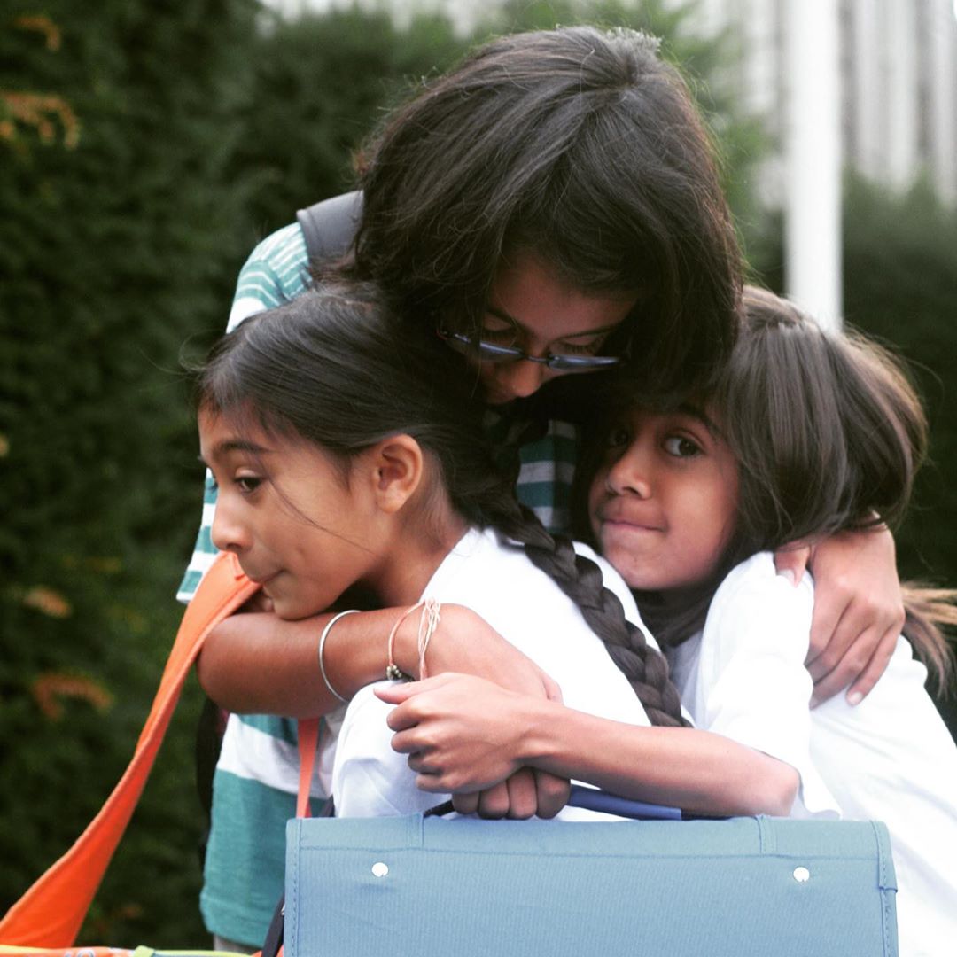 Mom hugging daughters. Photo by Instagram user @tanmeetsethimd