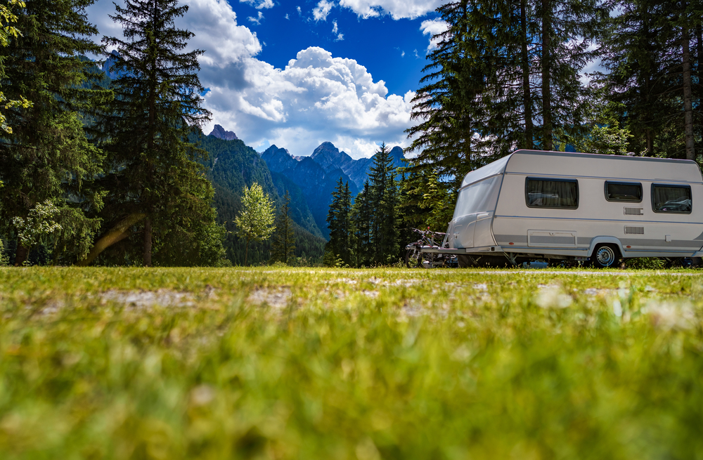 Camper van parked on side of the road in mountains