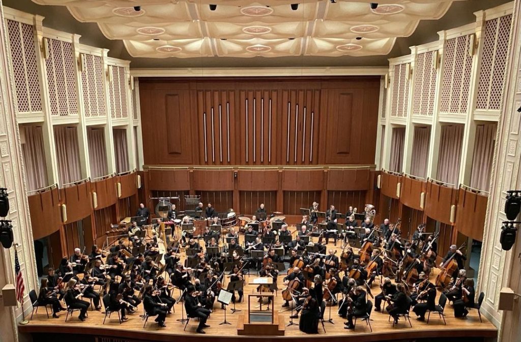 The Indianapolis Symphony Orchestra performing in a theater. Photo by Instagram user @jjschmidtbsu