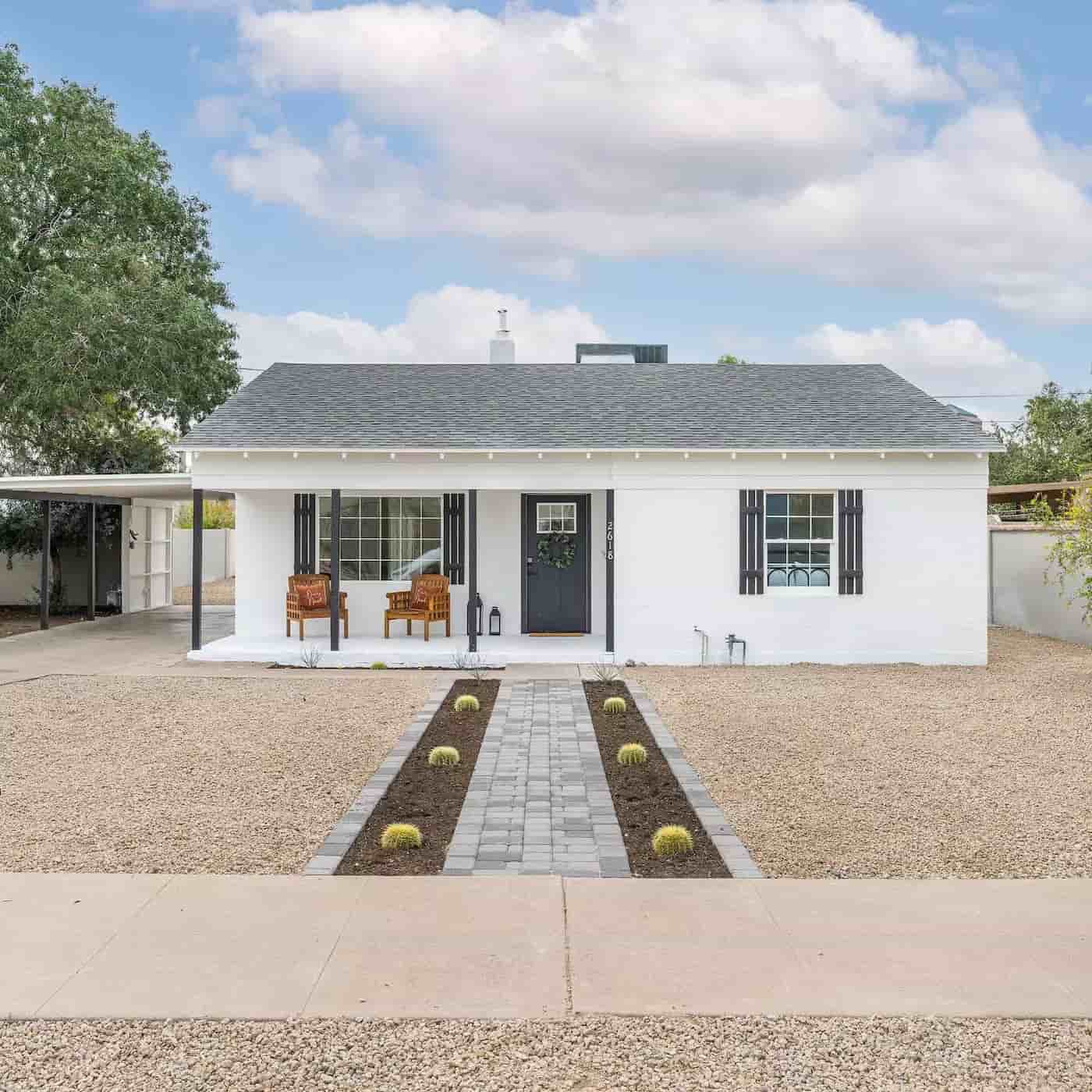 White Ranch-style home on a rock lawn in the Encanto neighborhood of Phoenix.