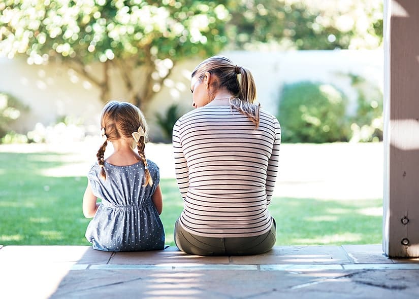 Mom and daughter talking on porch. Photo by Instagram user @child_life_grief_notes