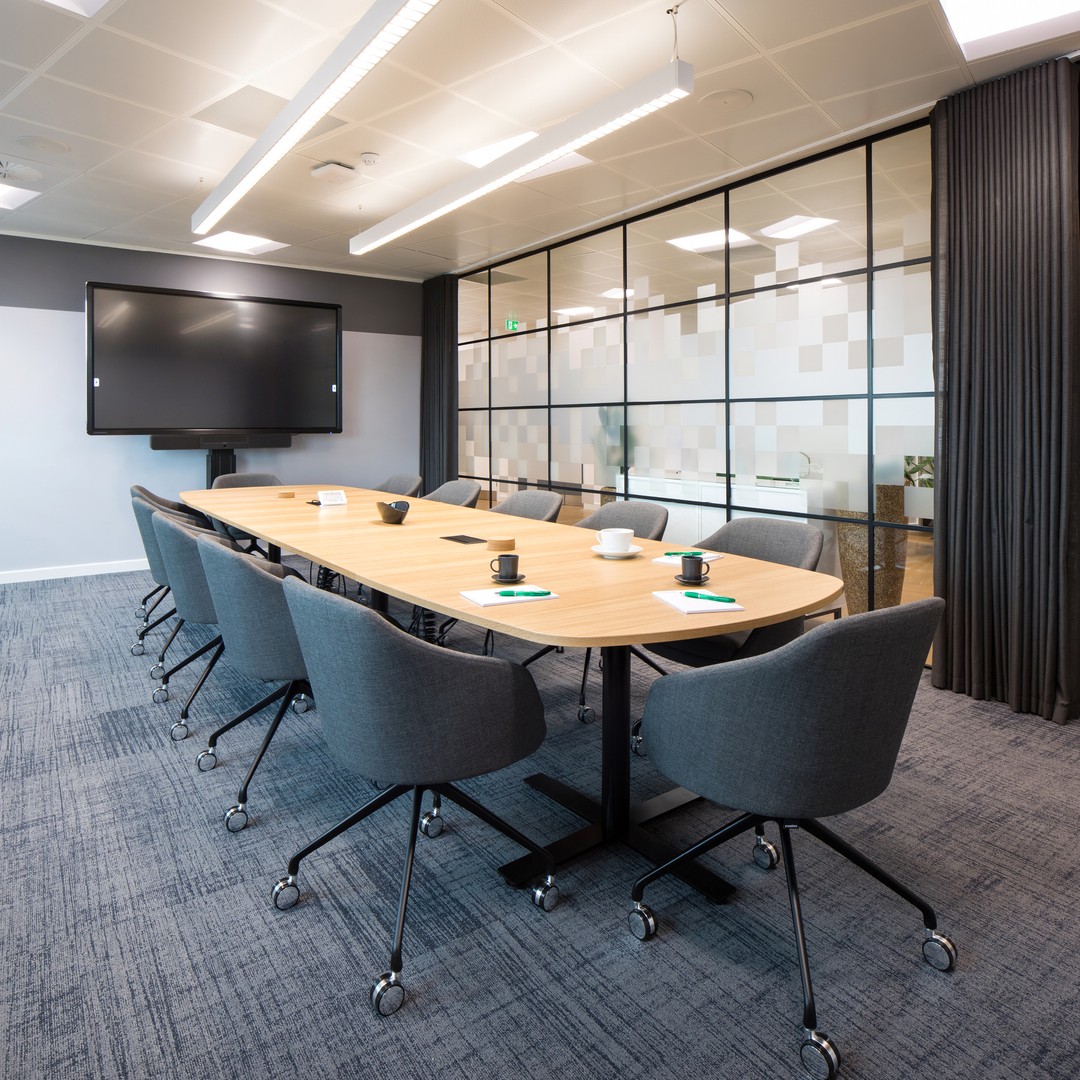 View of a conference room complete with long table and chairs.