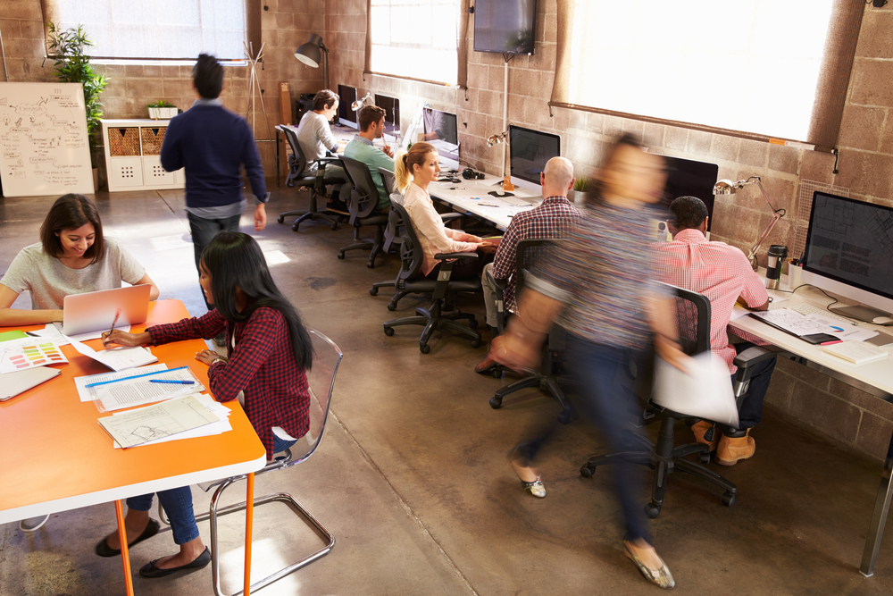 People working in a small office space