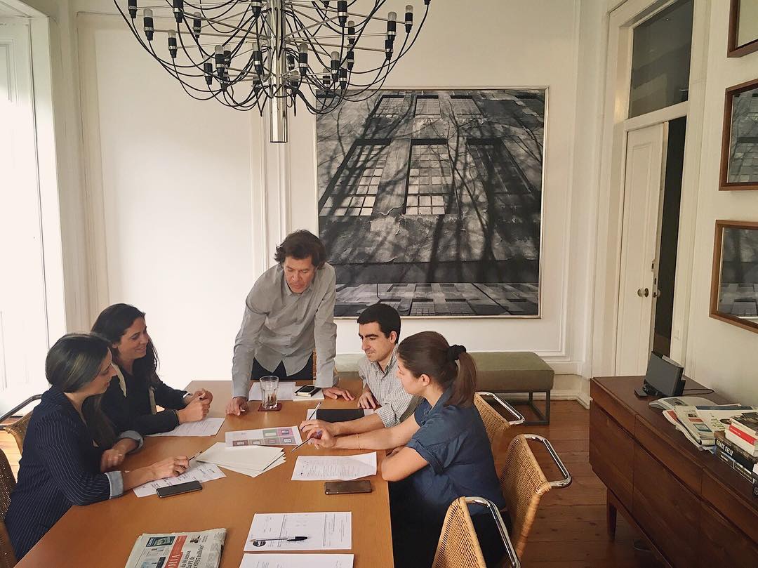 People Working Together in a Small Conference Room. Photo by Instagram user @globalpress