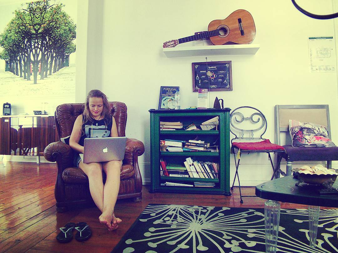 Woman Working at Home in a Leather Chair. Photo by Instagram user @carolinkraft