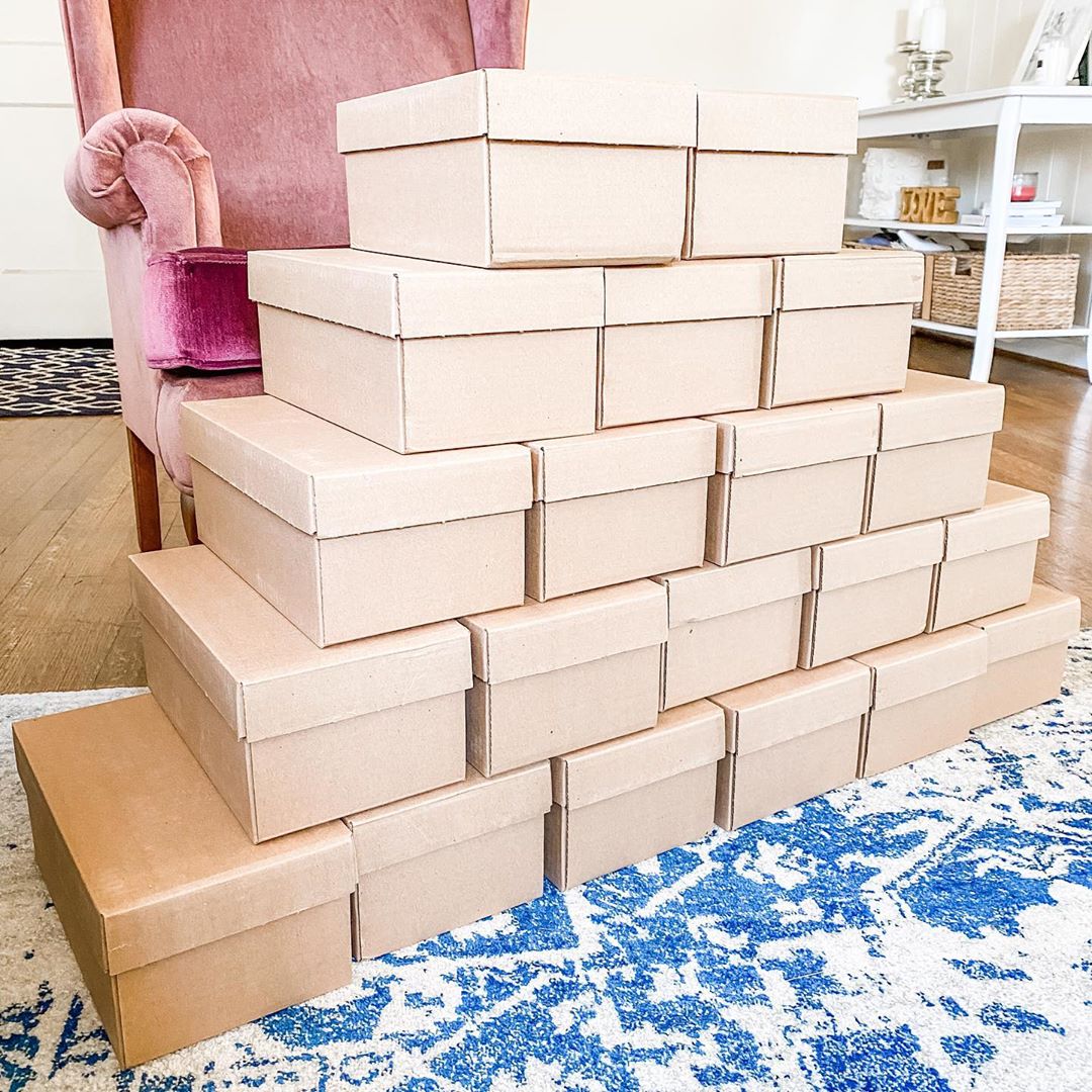 Stack of boxes for small business. Photo by Instagram user @thesinginglittlebirdshop