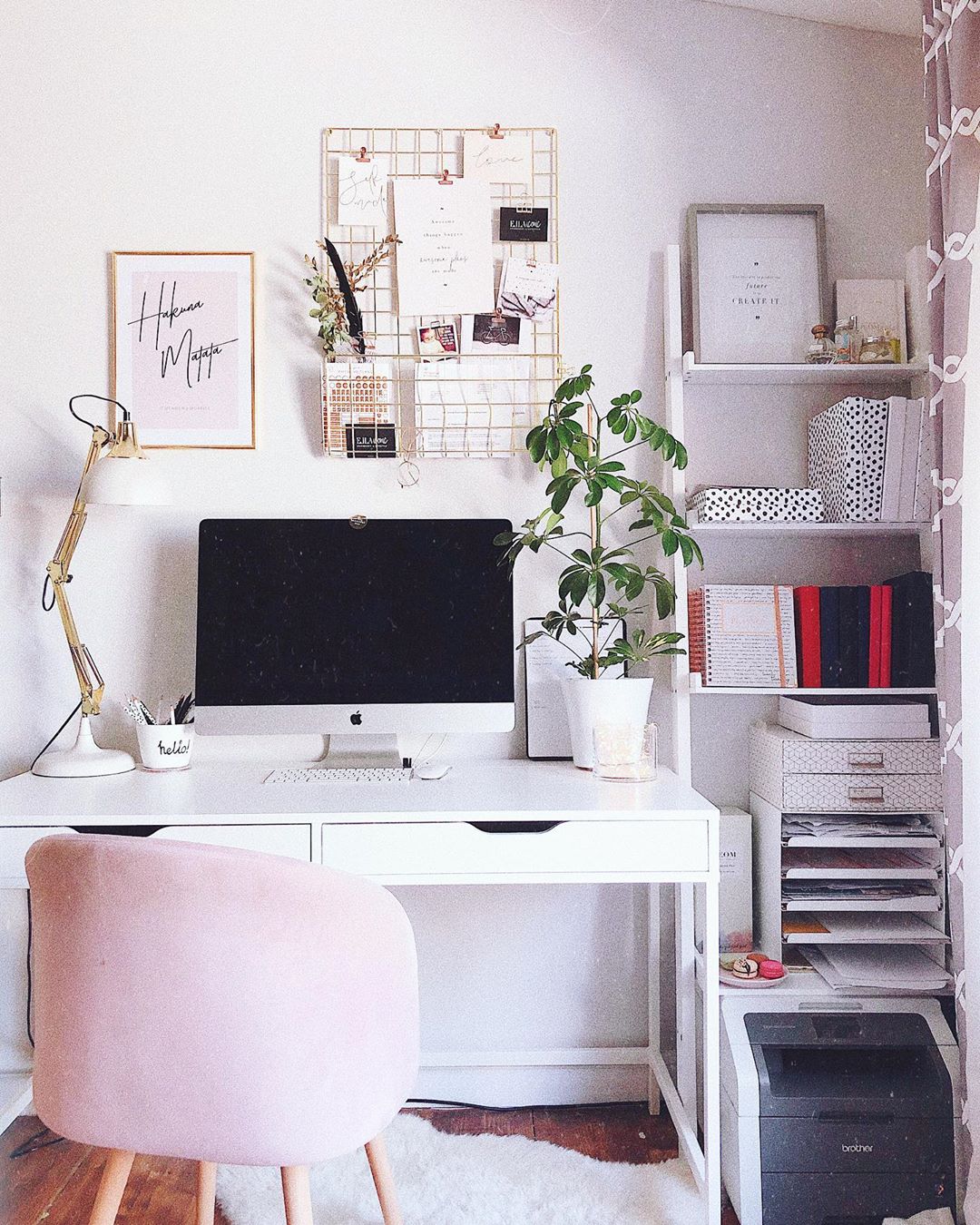 Pink, white, and gold home office space. Photo by Instagram user @ellaiconic