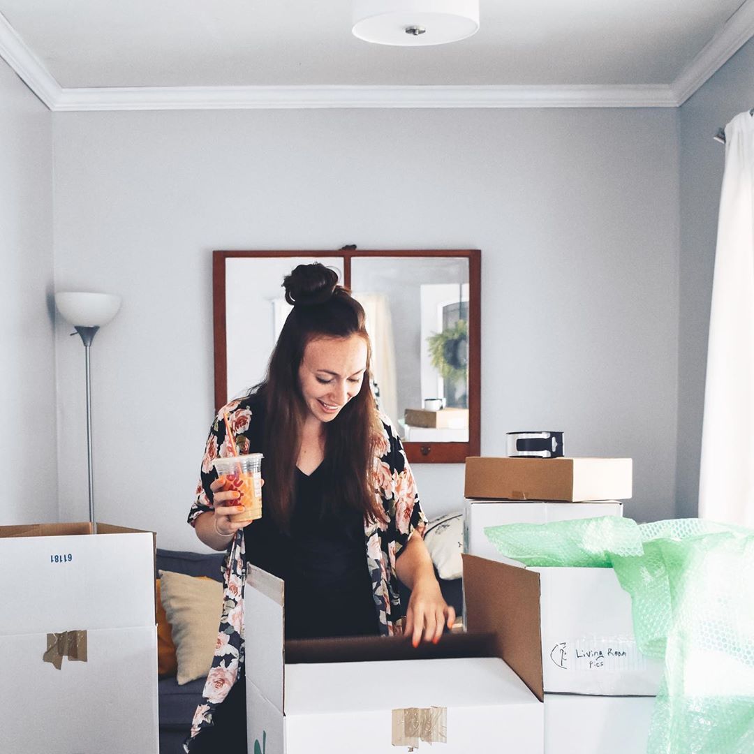 Woman unpacking moving boxes. Photo by Instagram user @ahopefulhood