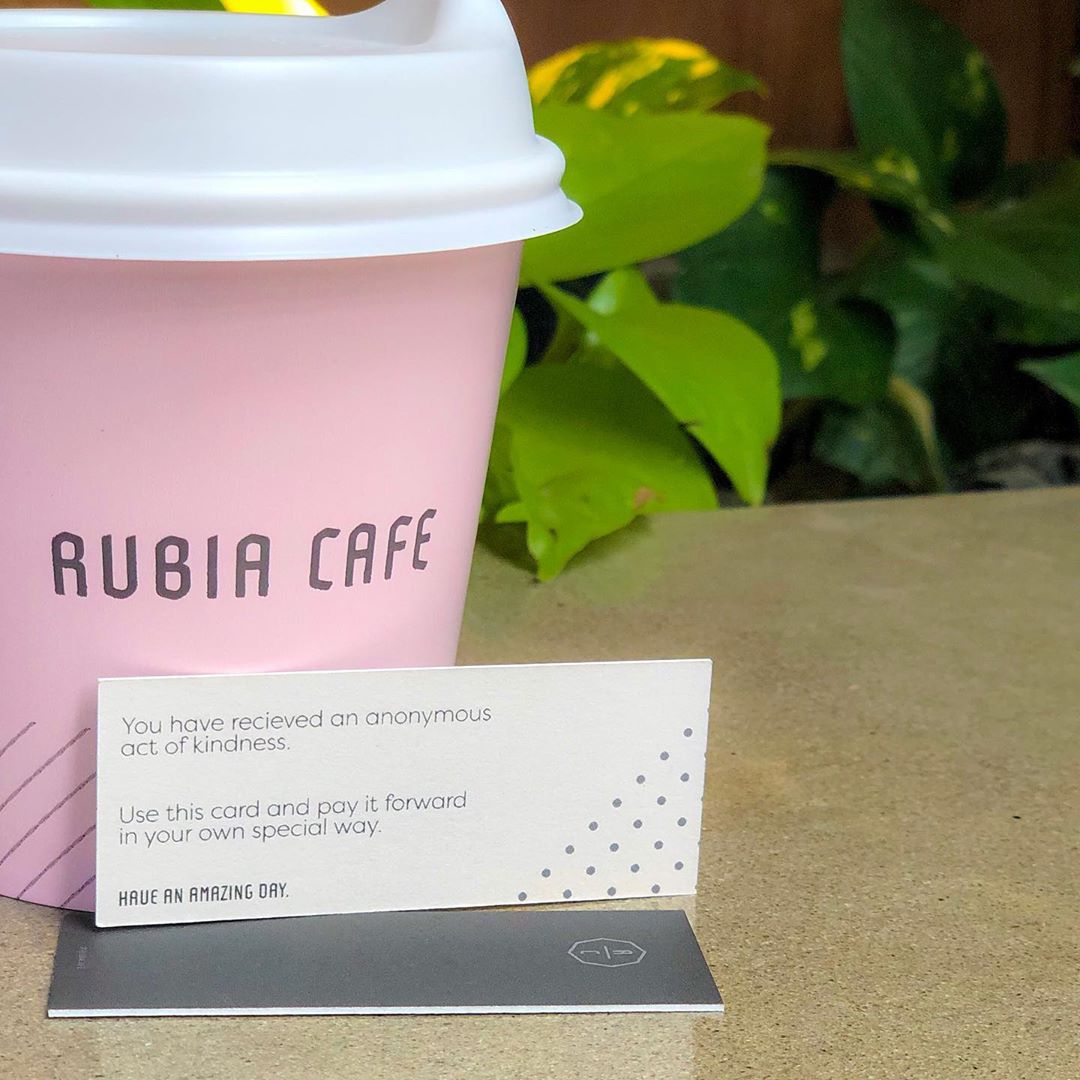 Pink to-go cup of coffee. Photo by Instagram user @rubiacafe