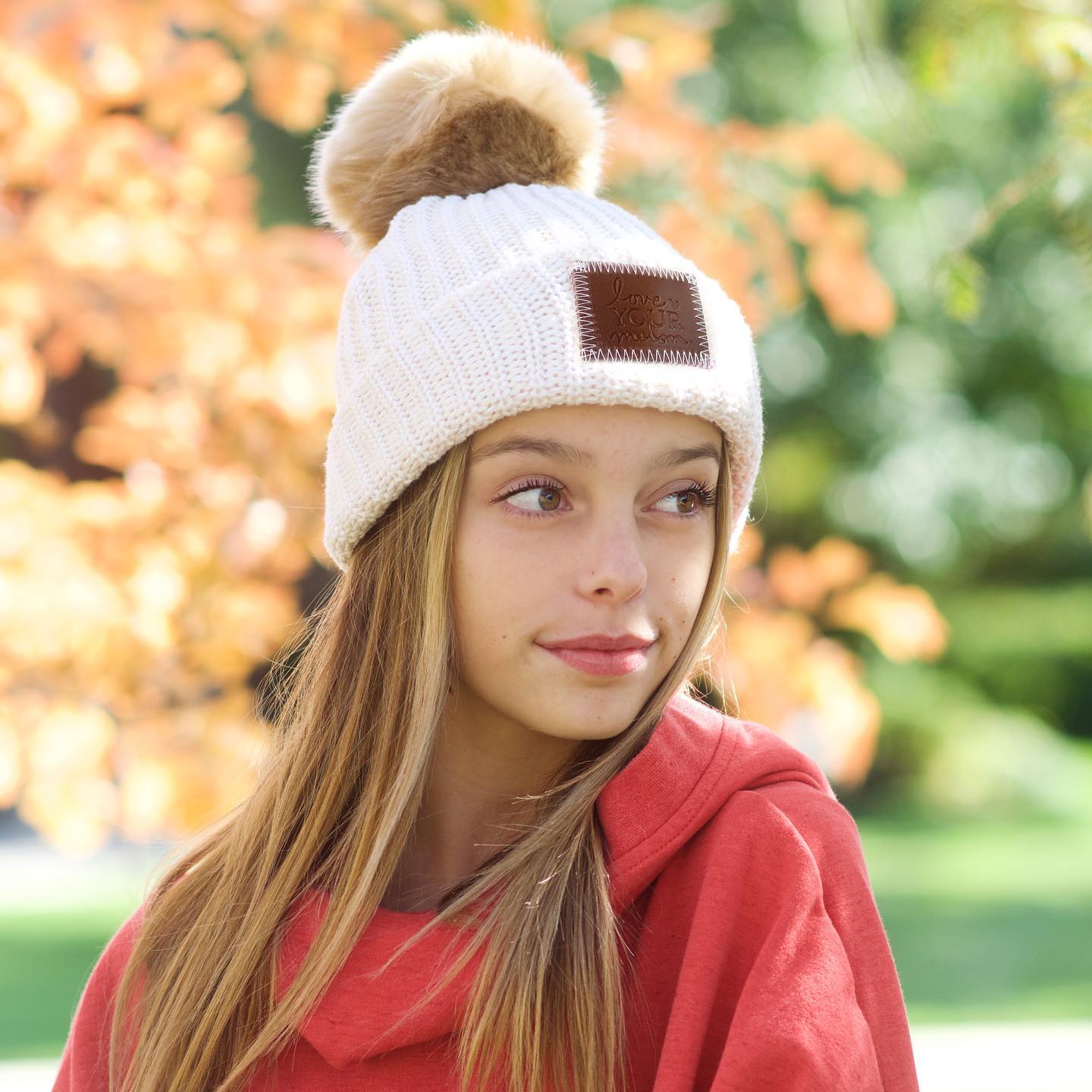 A model wearing a love your melon hat.