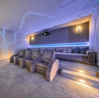 Gray Home Theater Room with Blue Lights. Instagram Photo by @freestyle_interiors