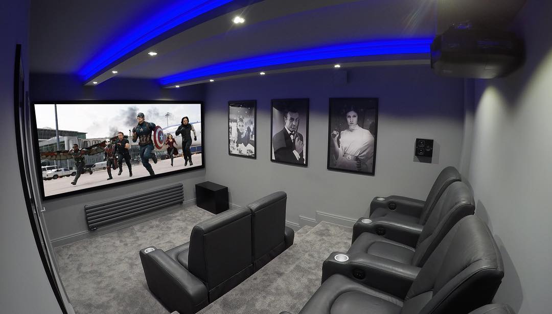 Grey Theater Room With Blue Lights. Instagram photo by @bespokehomecinemas