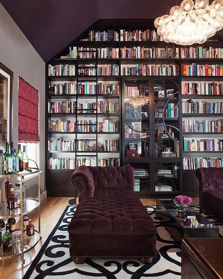 comfortable seating, purple lounger in large home library photo by Instagram user @dvmndsnmybkyard