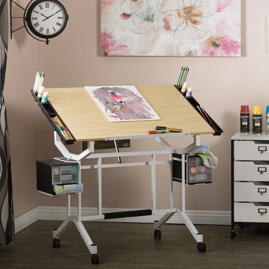 Adjustable craft room drawing table. Photo by Instagram user @studio_designs_inc