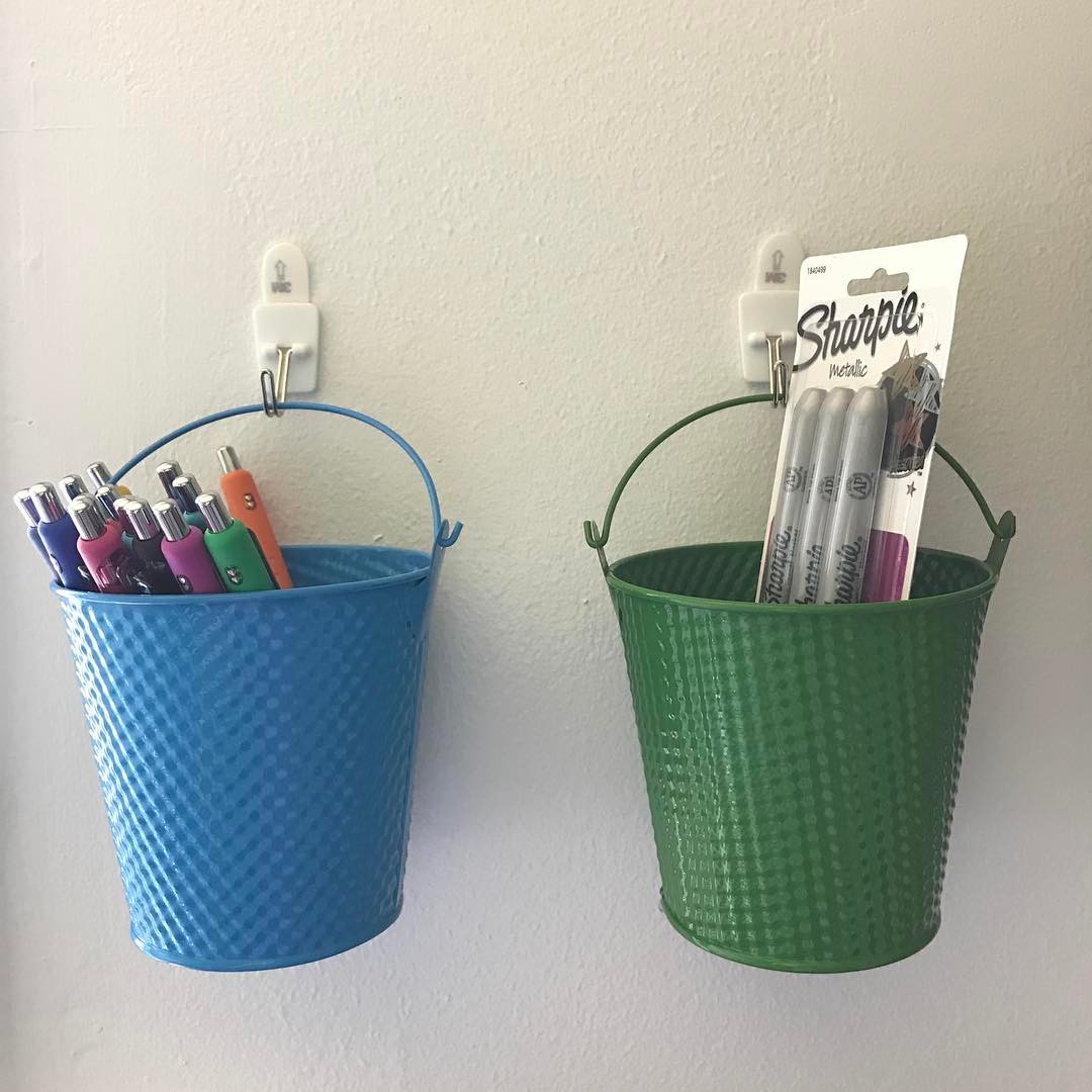 https://www.extraspace.com/blog/wp-content/uploads/2018/01/buckets-hooks-craft-room.jpg