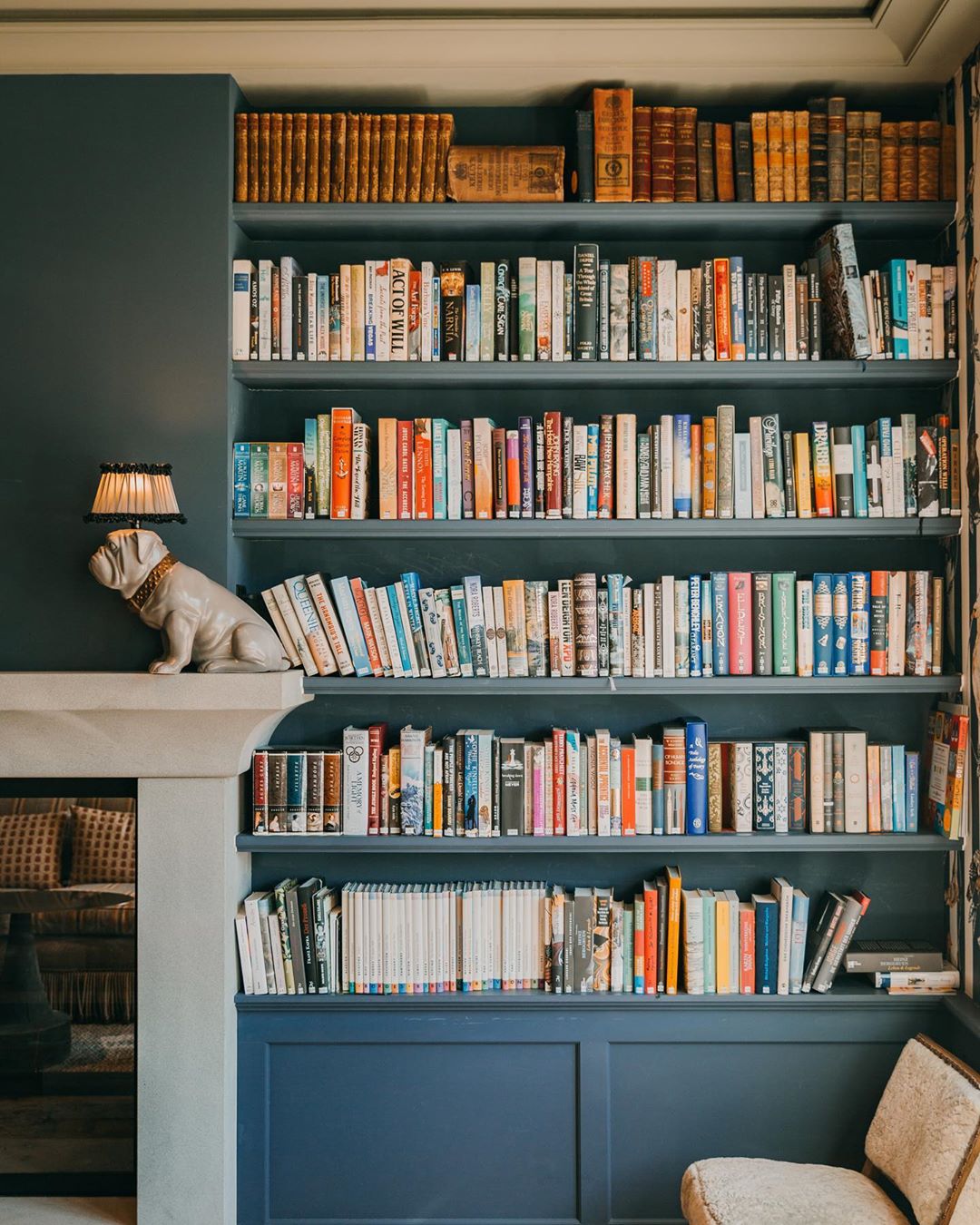 well organized bookshelf in home library photo by Instagram user @bellevuegstaad