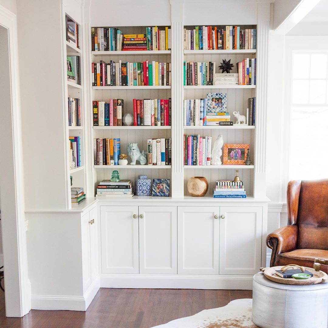 styled home library bookcase with knick-knacks throughout photo by Instagram user @carolynmackin
