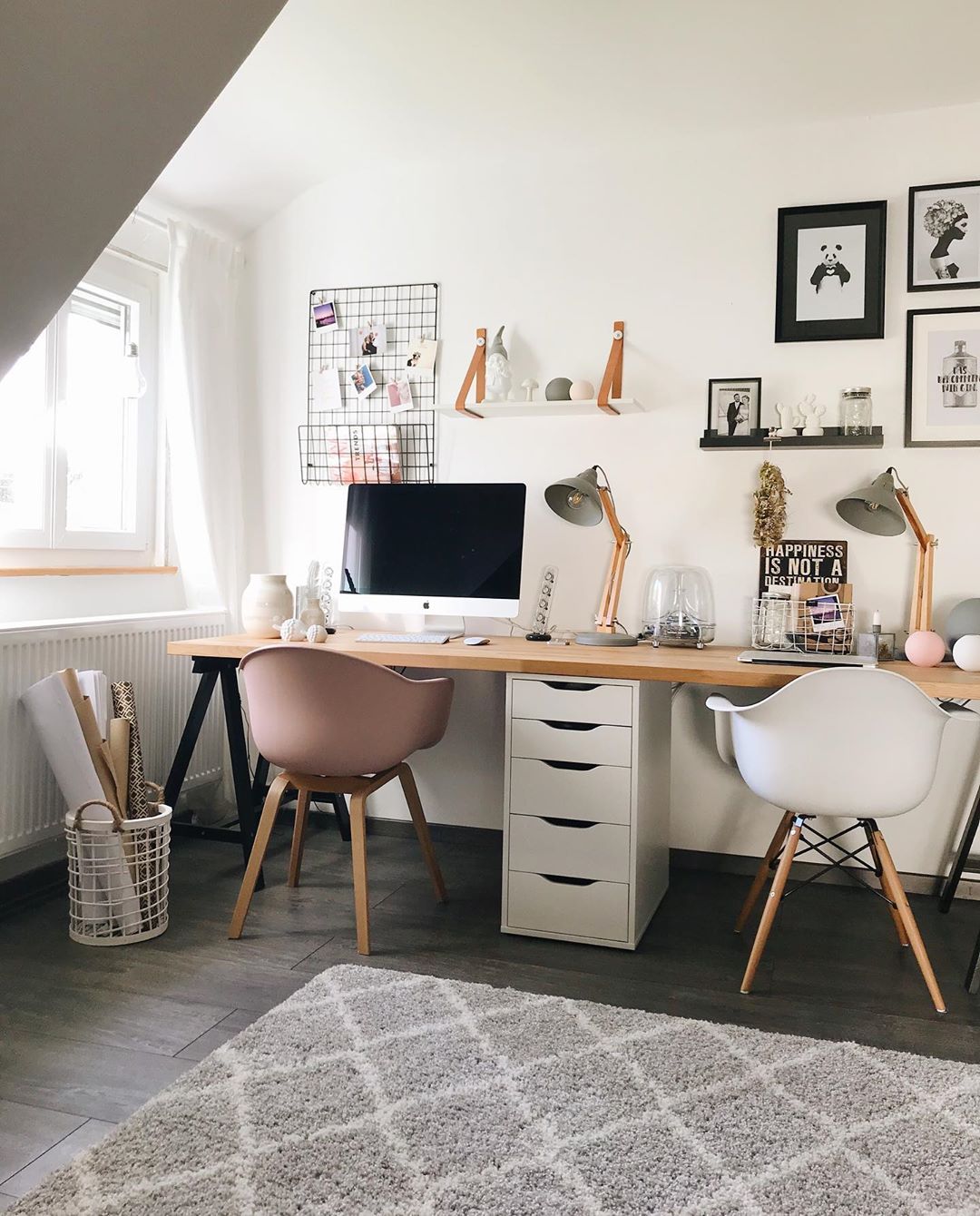 side by side desk space with wooden desk top and multi colored chairs photo by Instagram user @aplaceforus