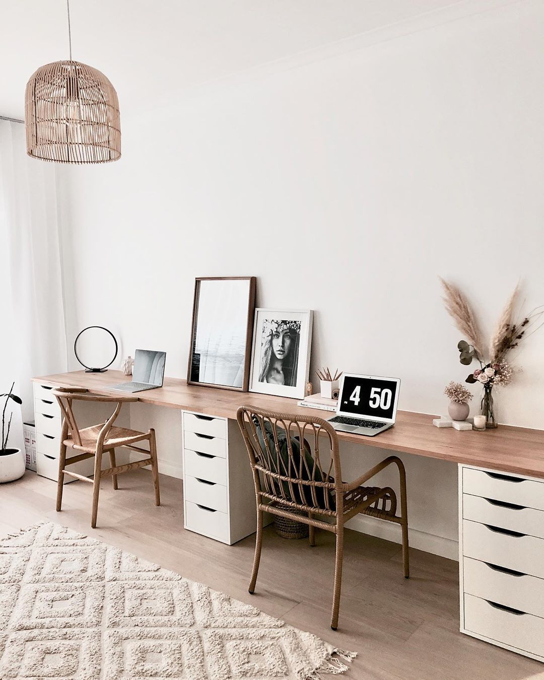long desk against a wall at home office with wooden chairs photo by Instagram user @life.with.aria.and.charlie